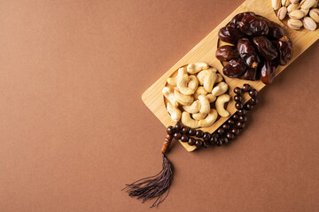 Ramadan kareem background with dates, cashews and pistachios