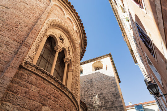 Kotor, Montenegro. Decorated window of Cathedral of Saint Tryphon in narrow street