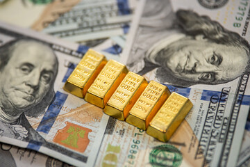 Pile of gold bars with dollar money representing inflation hedge and global market opportunity