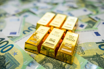 Euro money and gold bullion symbolizing economy trend, currency rate and financial performance