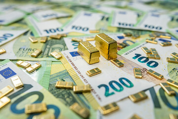 Euro money and gold bullion symbolizing economy trend, currency rate and financial performance