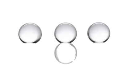 Three illuminated spheres, one with a ring beneath, on a black background