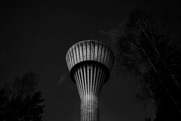 Black and White Water Tower Under Starry Night Sky