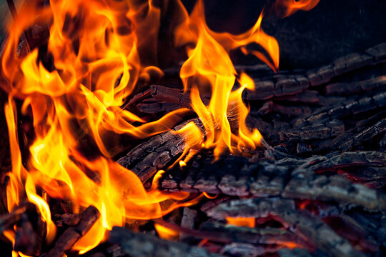 Full frame close-up of a stack of burning firewood in a bonfire