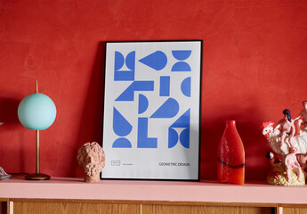 Mockup Of Customizable Black Framed Poster On Shelf