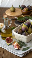 Fresh ripe figs in a ceramic dish with a bottle of olive oil arranged on a rustic wooden table with a linen cloth healthy food concept