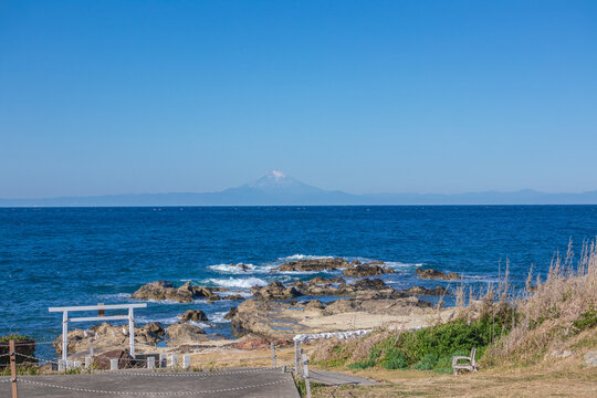 A distant view of Mount Fuji from the seaside torii gate of Suzaki Shrine, Tateyama City, Chiba Prefecture, Japan