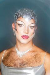 Latin Drag Queen With Silver Wig Poses in Studio With Light Streaks