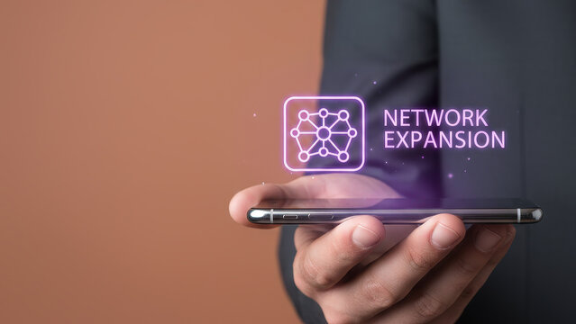 Business technology high speed level up planning strategy concept design network expansion mobile phone digital icon hand holding modern office - Powered by Adobe