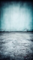 Grunge concrete floor extending into a blurred blue textured wall creating an abstract background