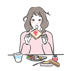 朝ごはんを食べる可愛い女性　トースト