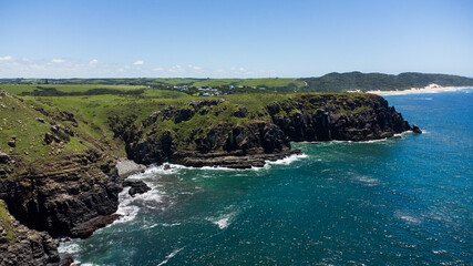 Aerial view of the ocean with cliffs