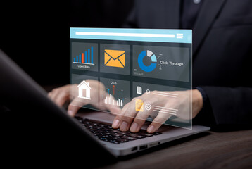 Digital marketing and analytics concept with business professional using laptop and virtual dashboard, showing email campaign metrics, open rate, click through data and performance analysis for busine