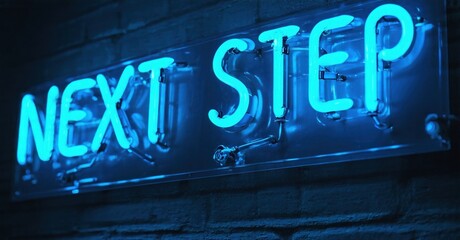 Bright blue neon sign displays NEXT STEP against dark brick wall. Simple message, bold illumination, modern aesthetic.