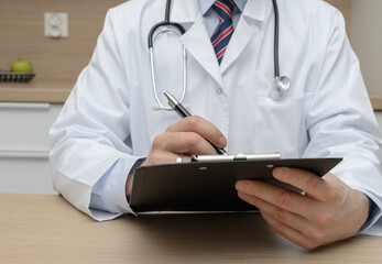 The doctor talks to the patient, performs a medical examination, and writes down recommendations