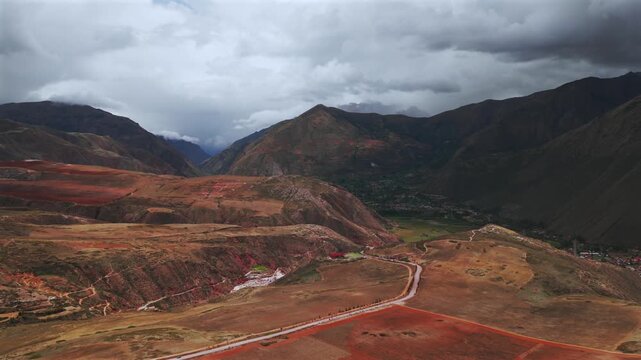 Sacred Valley Maras Salt Mine Peru Per&uacute; aerial drone Salineras de Maras rainy season cloudy Peruvian Andes Mount Patacancha Moray Chic&oacute;n Ancopacha Ollantaytambo Cusco region circle left motion