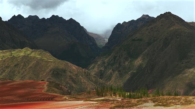 Peruvian Andes canyon Mount Patacancha Cuncani Pumahuanca glacier Sacred Valley Chic&oacute;n Peru Per&uacute; aerial drone rainy season rain clouds Quelccaya Urubamba range cusco region forward pan up motion