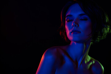 Fototapeta premium Photo of adorable dreamy lady nude shoulders enjoying herself empty space isolated neon light background