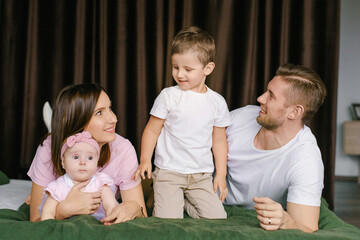 Parents Spending Time With Baby And Toddler Son