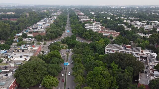 Chandigarh drone video - Aerial drone footage of Chandigarh city showcasing its modern urban planning, roundabout, wide roads, green spaces, and iconic architecture. Chandigarh roundabout drone view.