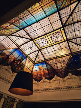 The magnificent stained-glass ceiling of the Brasserie de l'Univers in Tours, France. Belle Epoque artistry glass roof is classified as Historical Monument