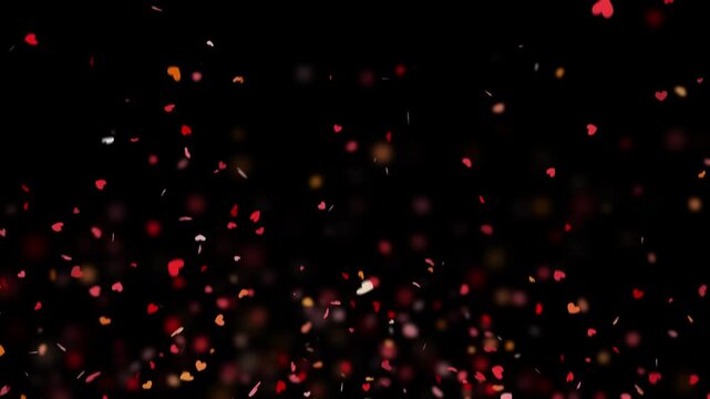Valentine's Day background. Explosions of red confetti hearts on a transparent background. Pro Res 4444.