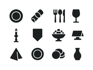 Festive Table Icons. Festive table setting. Solid icon set of festive table setting: plate set, napkin ring, cutlery set, wine glass, candle stick, table