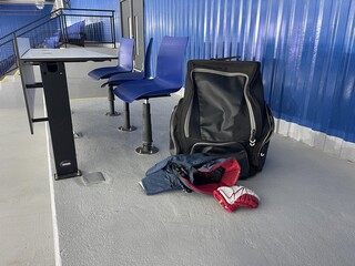 hockey guard and skates in ice stadium