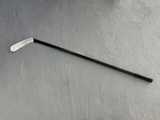 hockey stick isolated on gray background