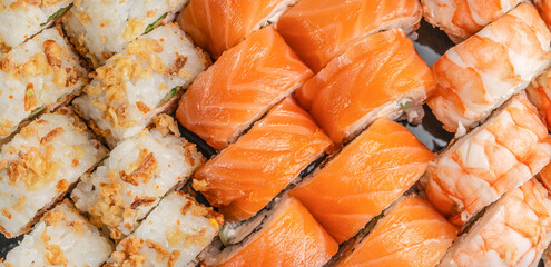 Assorted sushi set with salmon shrimp and crispy rolls top view © Надія Коваль