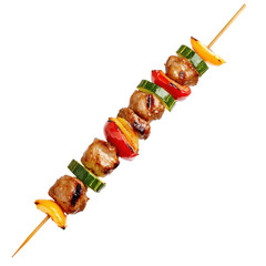 People celebrate summer by grilling skewers filled with meat and vegetables in a backyard during an outdoor gathering