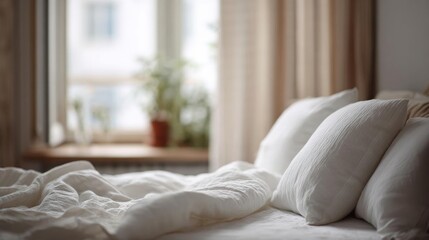 Fototapeta premium Close-up of a bed with white sheets and pillows. the bed is in front of a window with sheer curtains, and there is a potted plant on the windowsill.