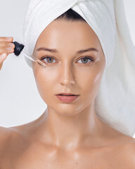 Beauty Spa Woman Applying Face Serum With Pipette After Shower Ritual
