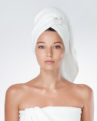 Spa Beauty Concept With Woman Wrapped In White Towel On Clean Background
