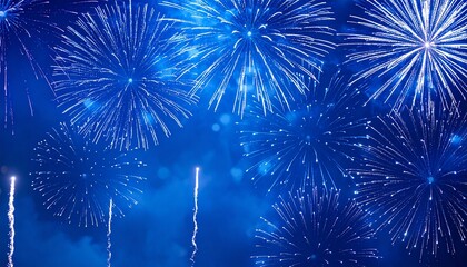 Brilliant blue fireworks illuminating the night sky during a festive celebration or holiday event