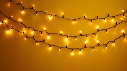 Warm Yellow String Lights Curved on Orange Background for Festive Decoration