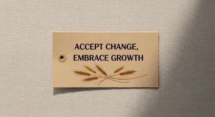 A natural wood tag with a motivational message about change and growth, adorned with wheat stalks.