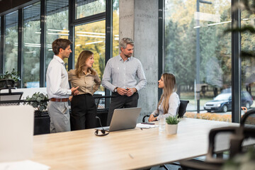 Group of happy progressive business people working on startup together at creative office