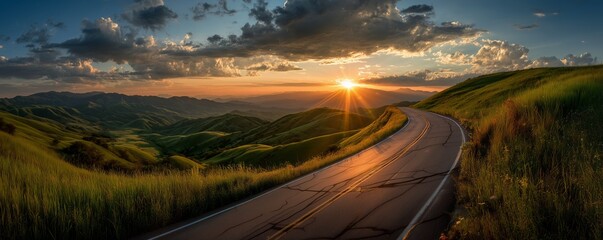 Winding road traversing vast rolling green hills illuminated by a dramatic sunset with sunburst, concept for travel advertising, nature photography and destination brochures