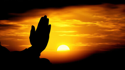 Hands clasped in prayer against a sunset.