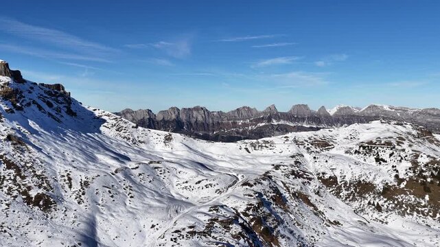 Aerial view of snow-covered Churfirsten ridges above Walensee and Flumserberg in winter. Switzerland