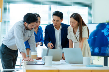 Teamwork meeting,tablet and asian business people in office workplace.Collaboration,technology and workers,men or employees with planning sales on laptop,financial strategy or research in company