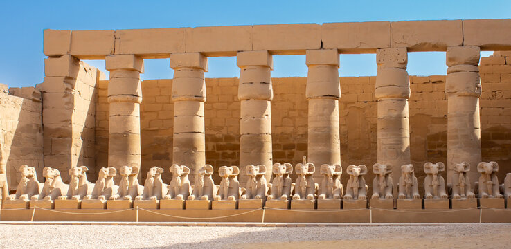Historical monuments of Luxor, Egypt, statues and columns in ancient buildings. Tourism and history concepts.