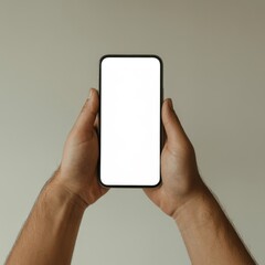 Hands holding a smartphone with a blank white screen against a neutral beige background, centered composition with soft even lighting and minimal appearance.
