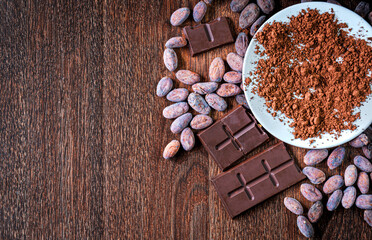 Cocoa powder ,organic cocoa beans Ingredient for preparating chocolate . Top view of Chocolate bar