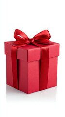 Fototapeta premium A Present Wrapped in Red: A beautifully wrapped gift, featuring a vibrant red box adorned with a matching satin ribbon, exudes an air of anticipation and generosity.