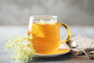 Herbal Tea with Elder flower on wooden background. Healing drink