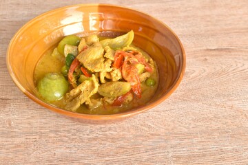 spicy boiled slice pork with eggplant in curry soup on bowl