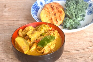 spicy boiled slice pork eggplant in curry soup eat couple grilled sticky rice with egg and curly kale vegetable on plate