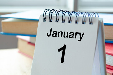 Desk calendar showing January 1 on blur office background